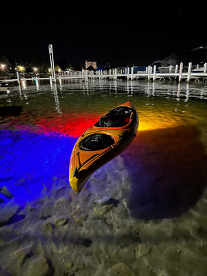 E-Sea Light- Suction Mounted Waterproof Floodlight- Underneath kayak at night demonstrating different color modes