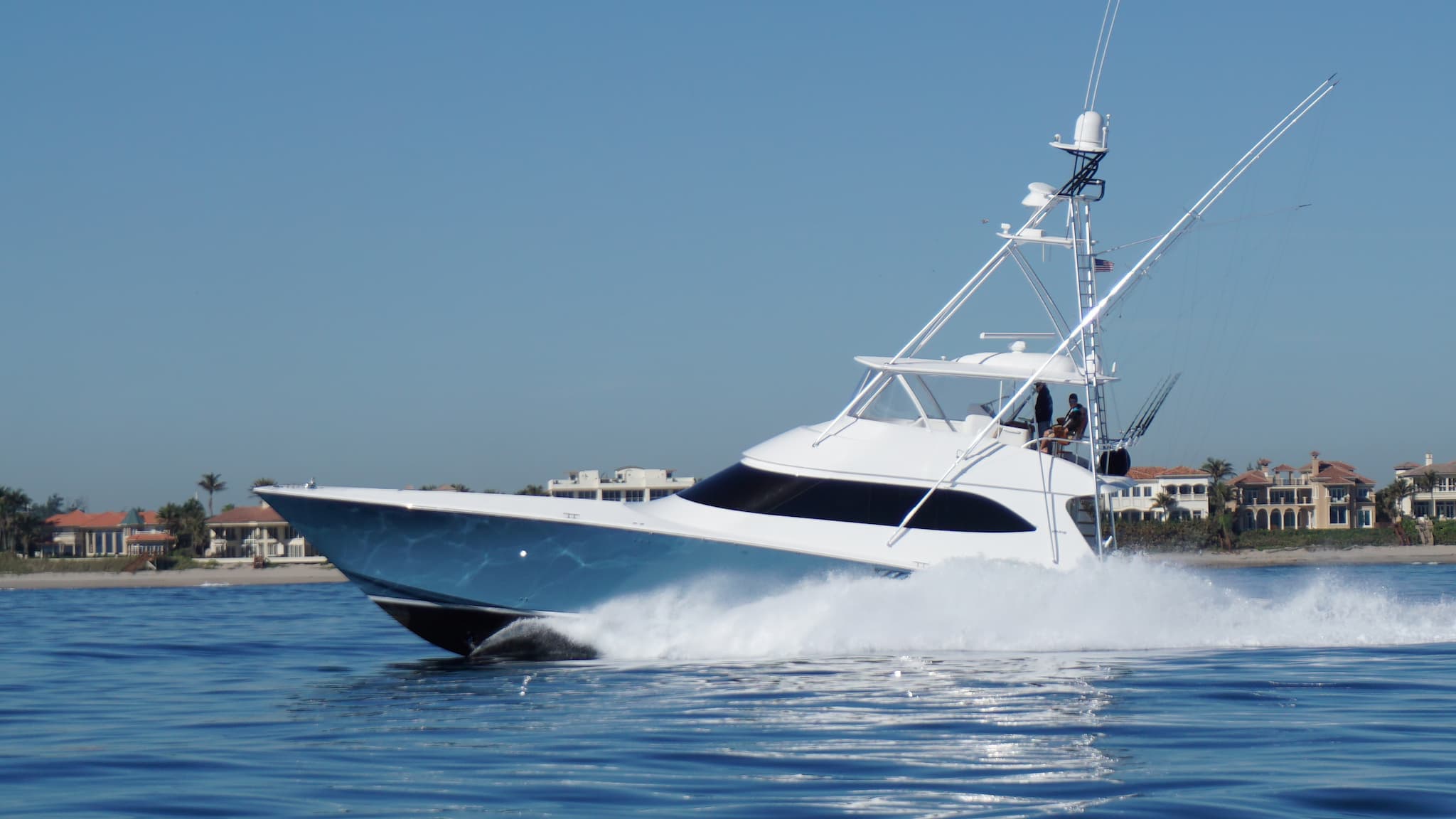 Sport Fishing boat on the ocean with fishing rods on the tower