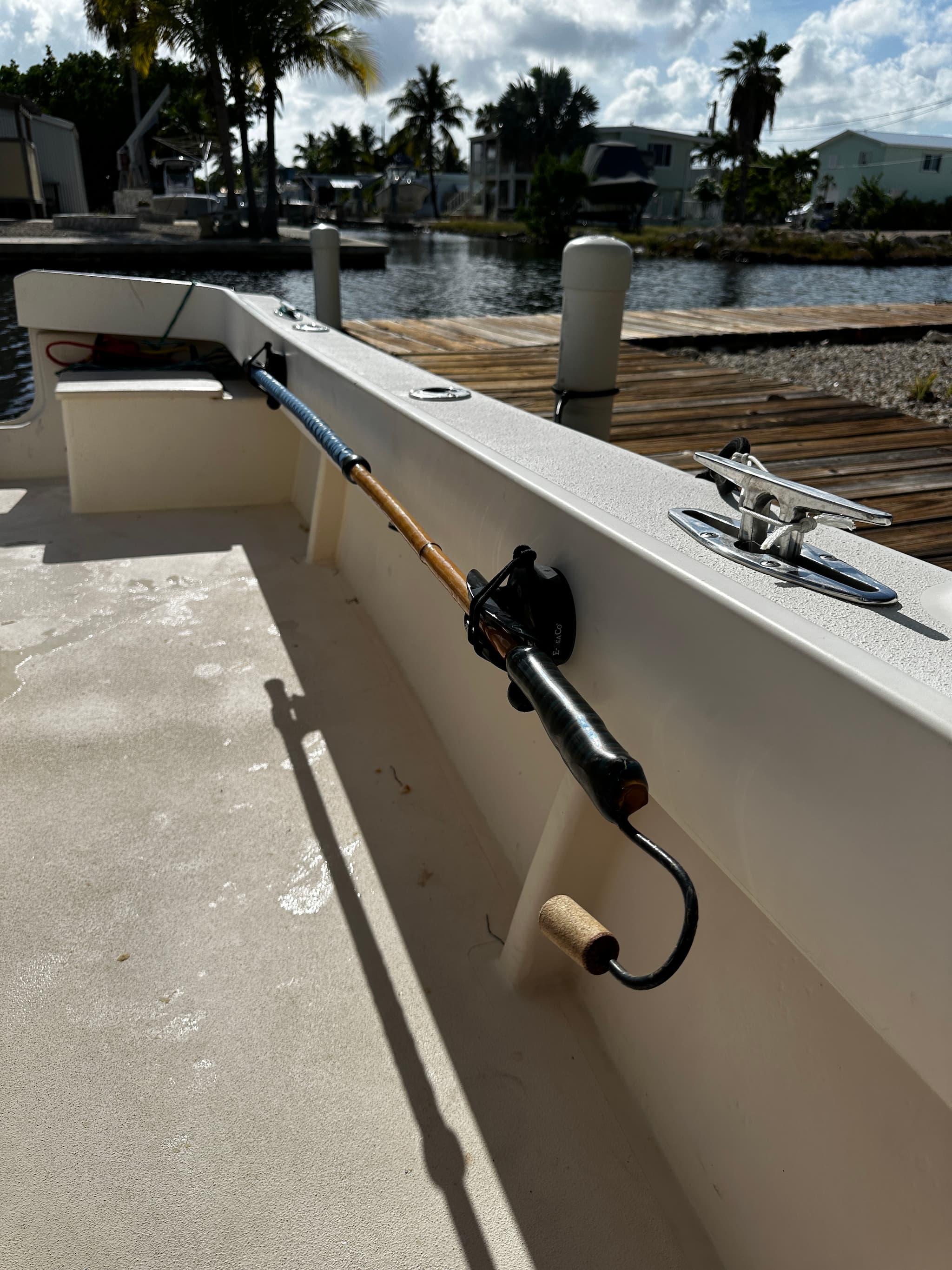 E-Sea Paddle & Utility Clip used as a fishing gaff holder on boat gunnel