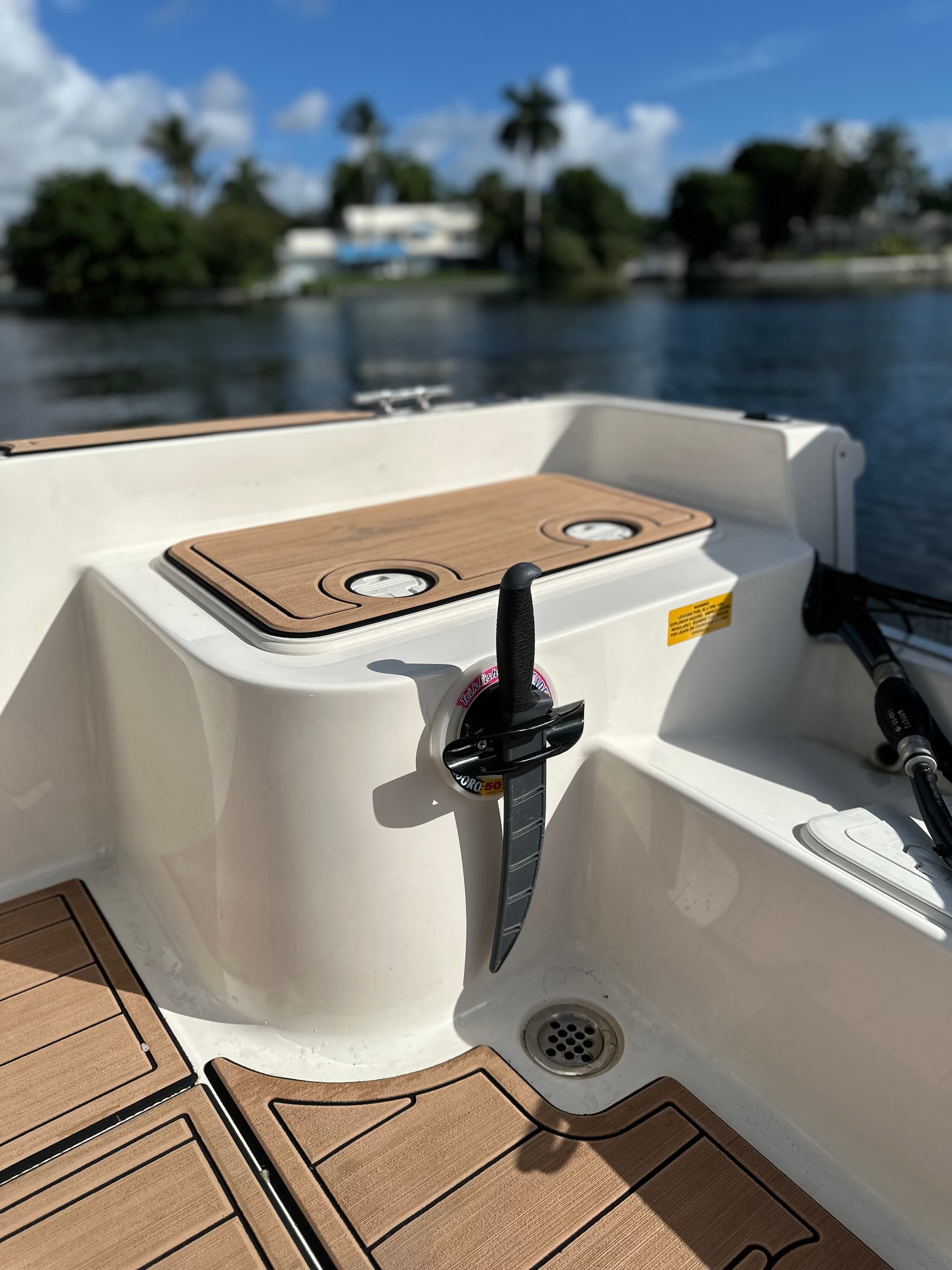 E-Sea Paddle & Utility Clip used as a filet knife holder on boat transom