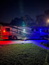 Three E-Sea Lights suction mounted to an RV lighting up the campsite