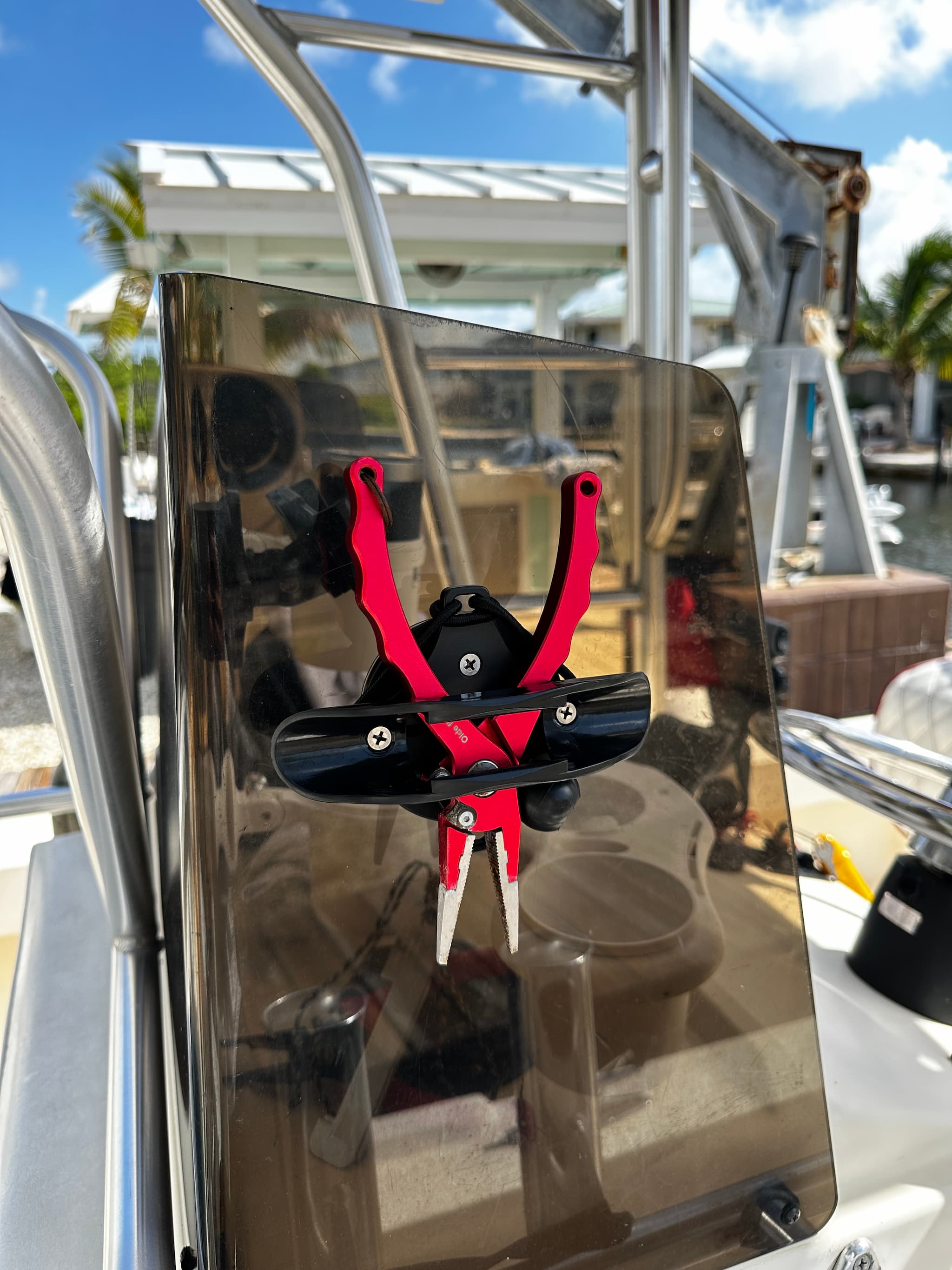 E-Sea Paddle & Utility Clip used as a plier holder on boat console