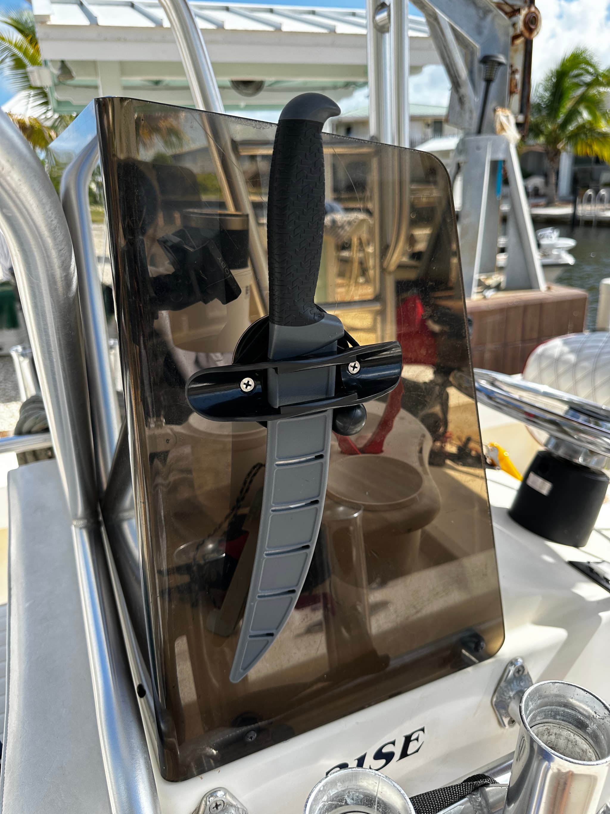 E-Sea Paddle & Utility Clip used as a filet knife holder on boat console