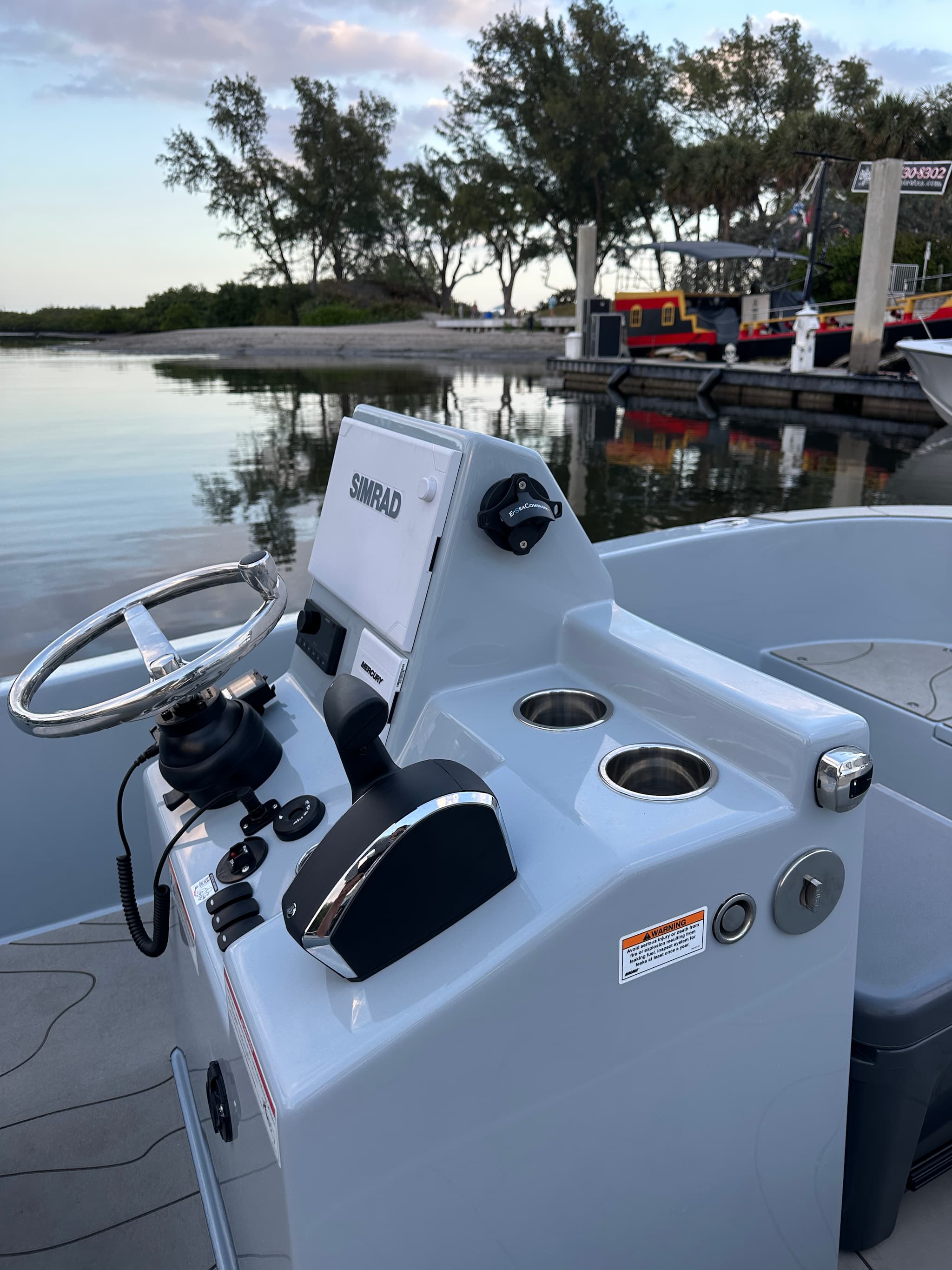 A boat console with an E-Sea bottle opener suction mounted to the side