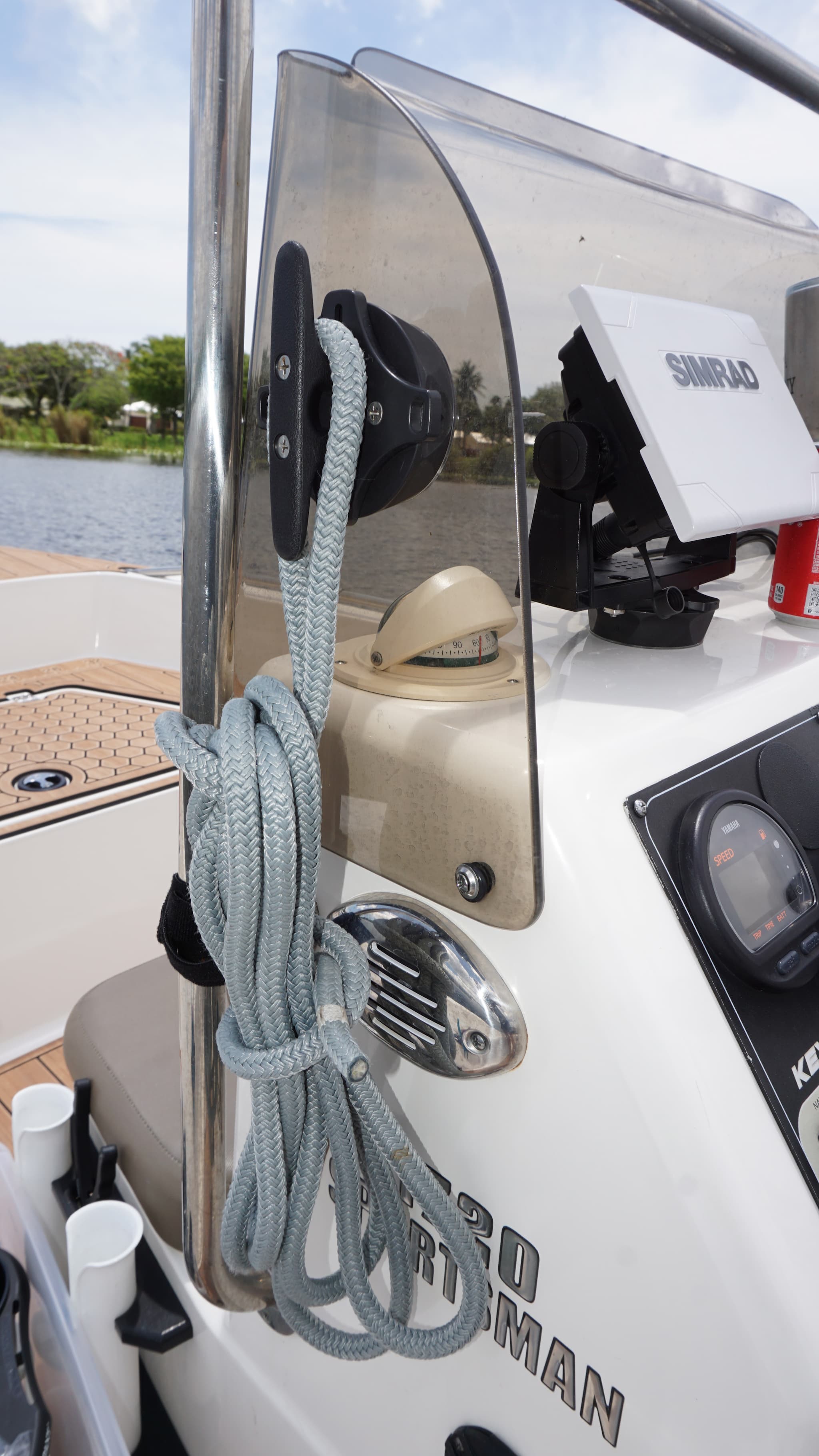 E-Sea Cleat suction mounted to boat console being used to store a dock line.