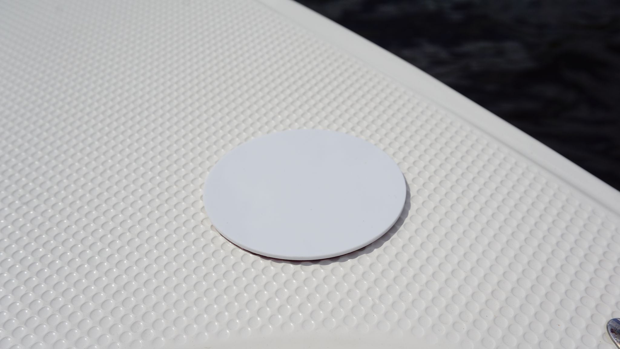 E-Sea Disc mounted to boat non-skid material.