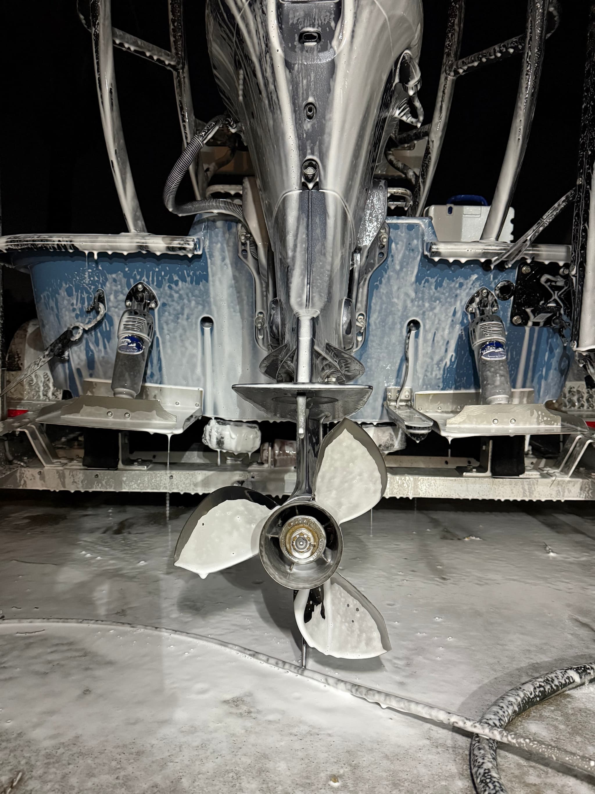 Close-up of a boat propeller and engine with 1st due salt remover suds