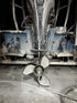 Close-up of a boat propeller and engine with 1st due salt remover suds